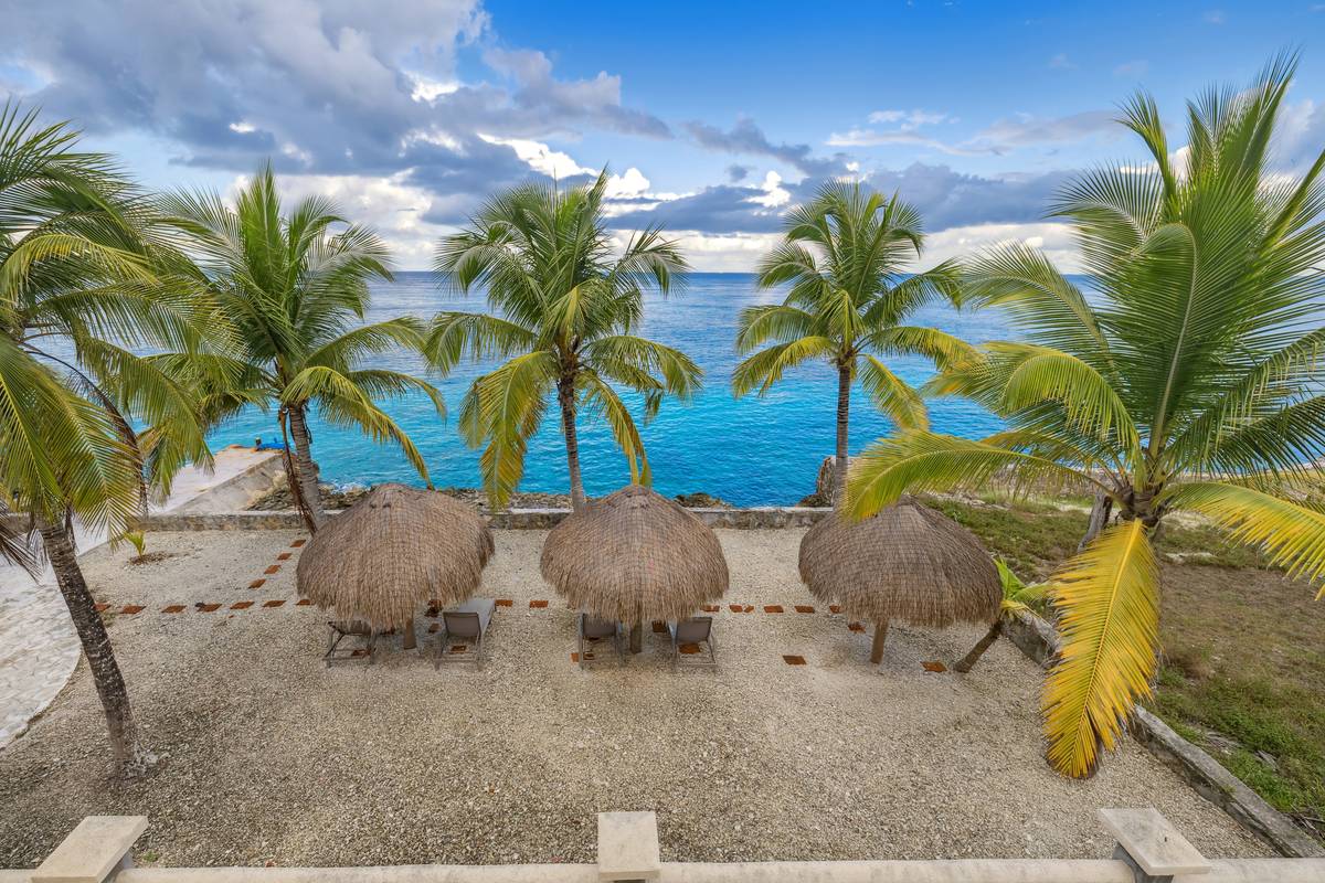 Palapas on the sand at Caballos Del Mar