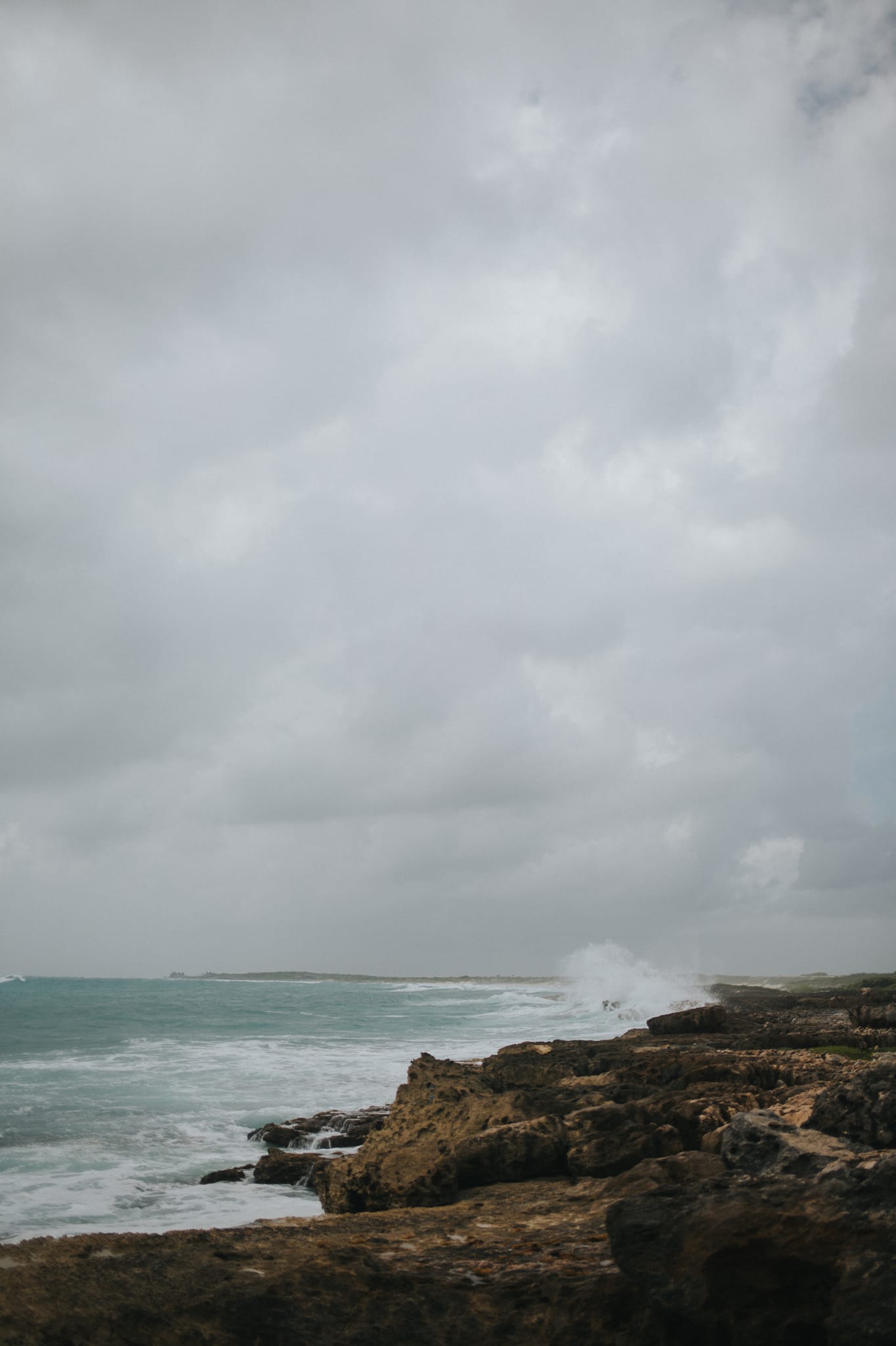 Waves breaking on the rocky shore at Punta Sur